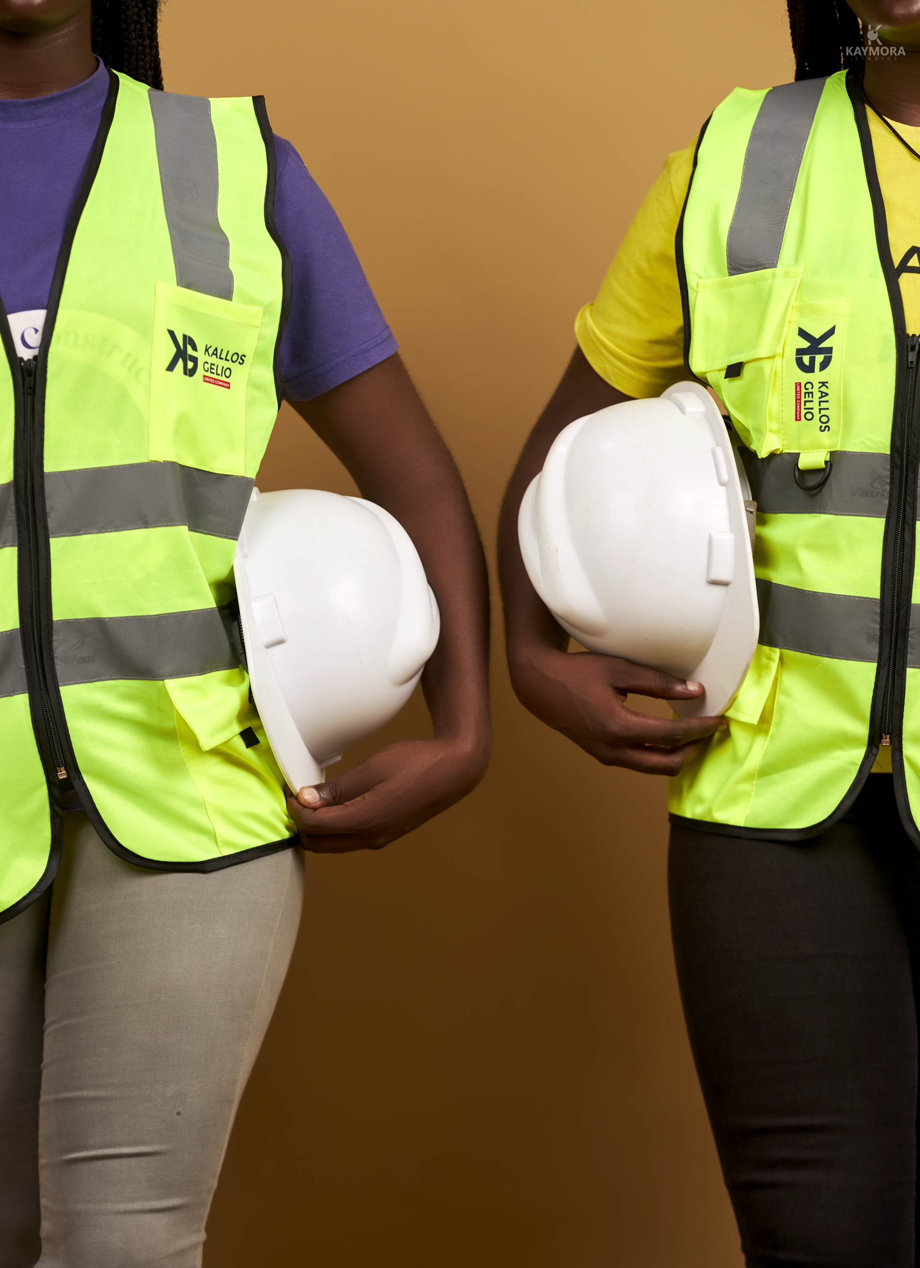 Site supervisor reviewing drawings with clients