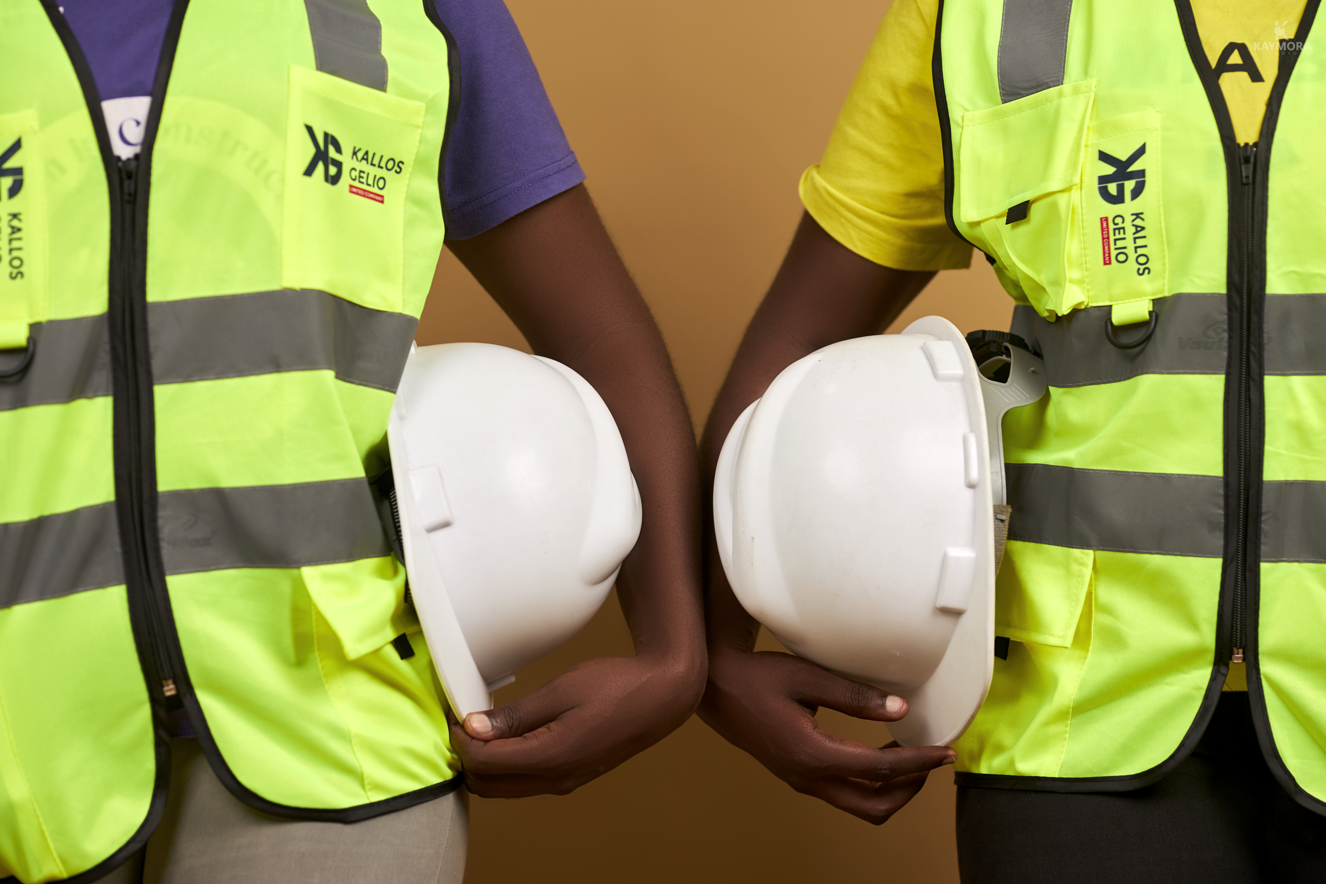 Workers polishing terrazzo flooring inside a commercial space