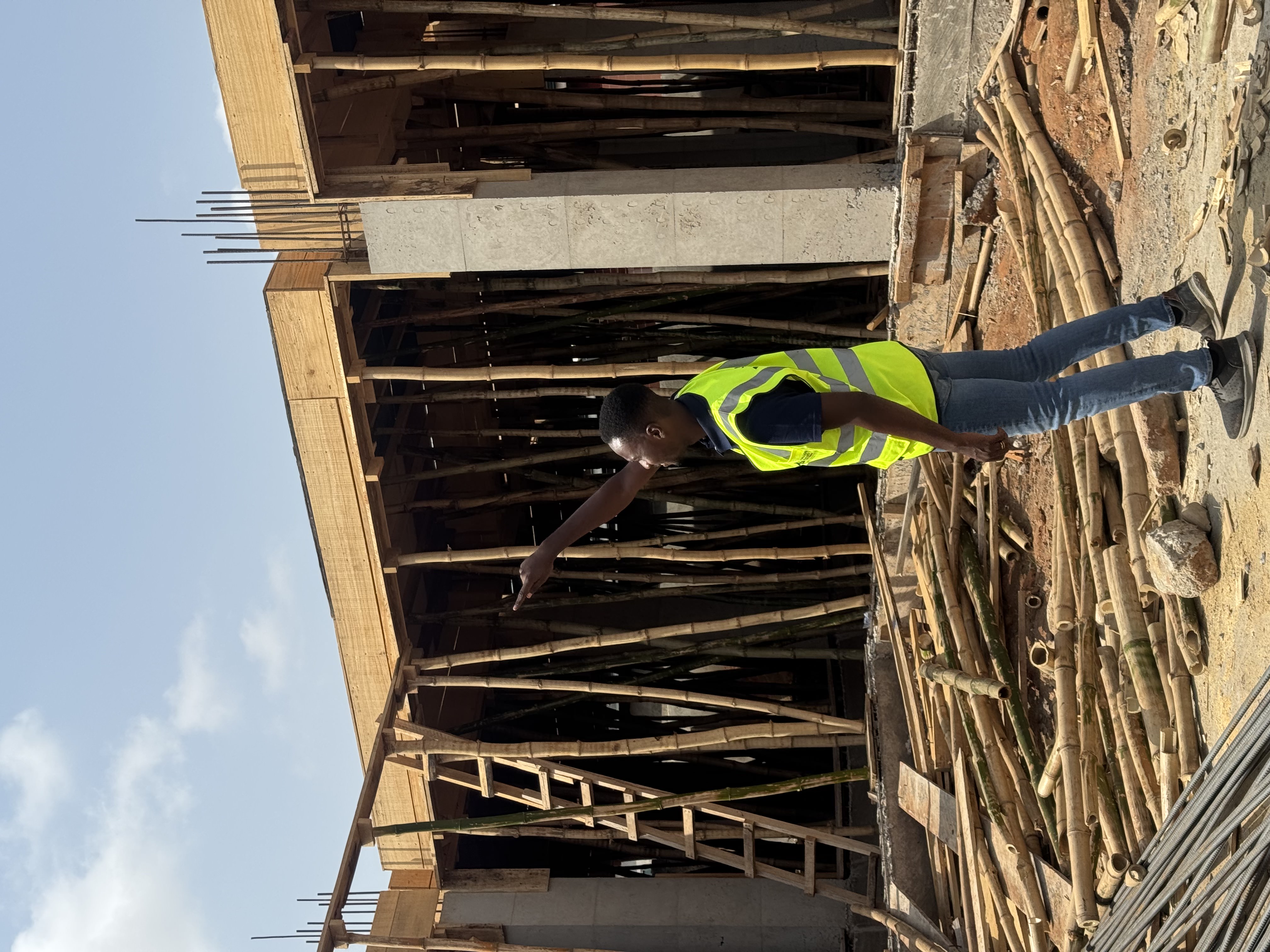 Ghanaian construction crew working from scaffolding in Accra