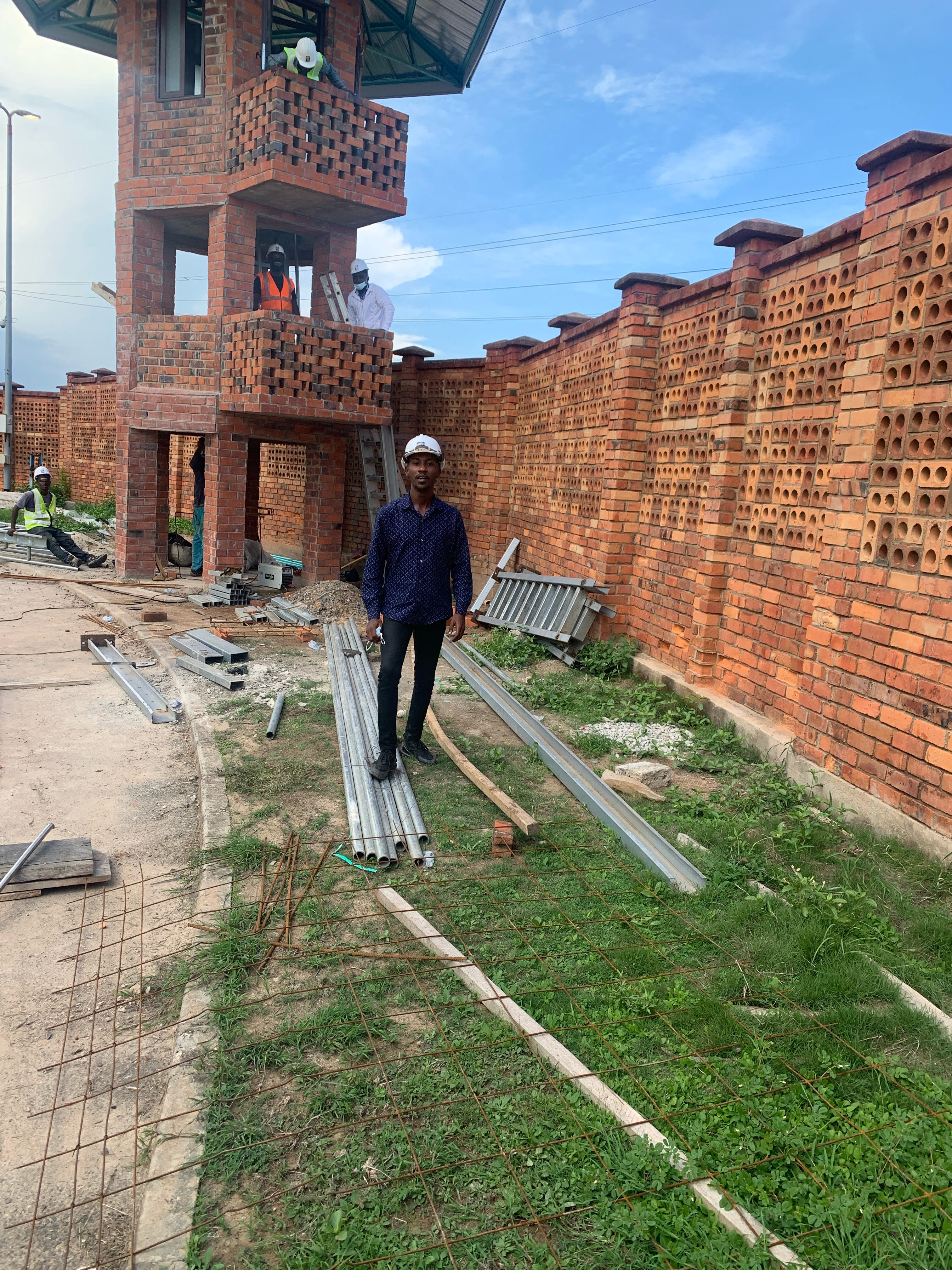 Coastal villa site with survey equipment near the shoreline