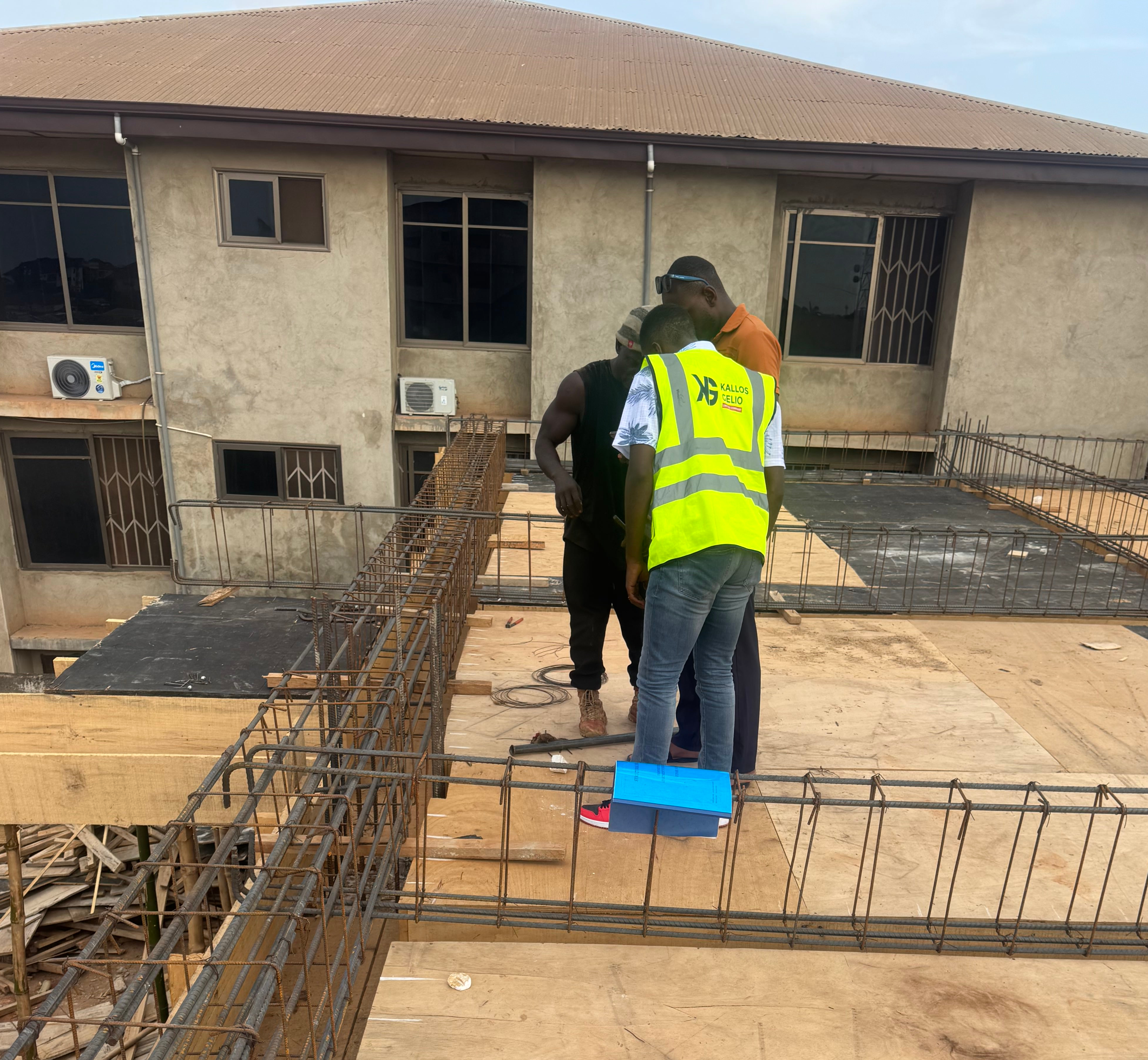 Supervisors reviewing markups during a weekly coordination huddle